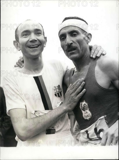Jun. 26, 1966 - Alain Mimoun, who won the 10,000 M race in Paris a week ago, surprised us again by winning the Marathon in front of Combes at 46 years-old. Picture: After his victory, Combes congratulates Mimoun.