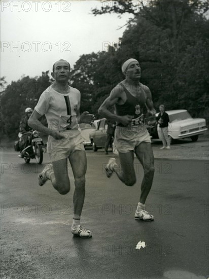 Jun. 26, 1966 - Alain Mimoun, who won the Paris's 10,000 meter race a week ago, surprised us again by winning the Marathon in front of Combes at the age of 46. Combes and Mimoun are pictured running the course here.