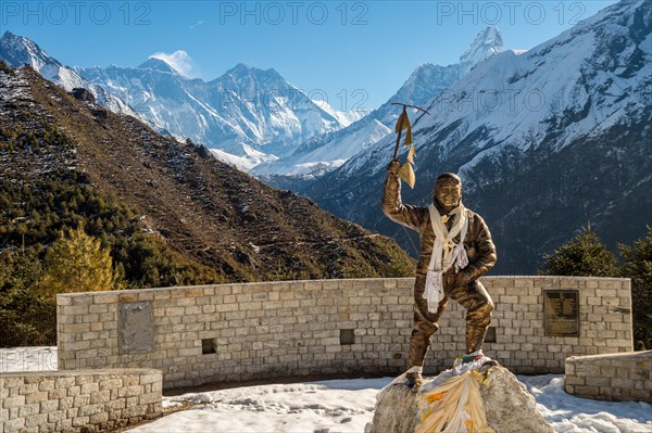 Part of Himalaya mountain range, with Mount Everest on the left, and Ama Dablam on the right, with statue of Sir Edmund Hillary