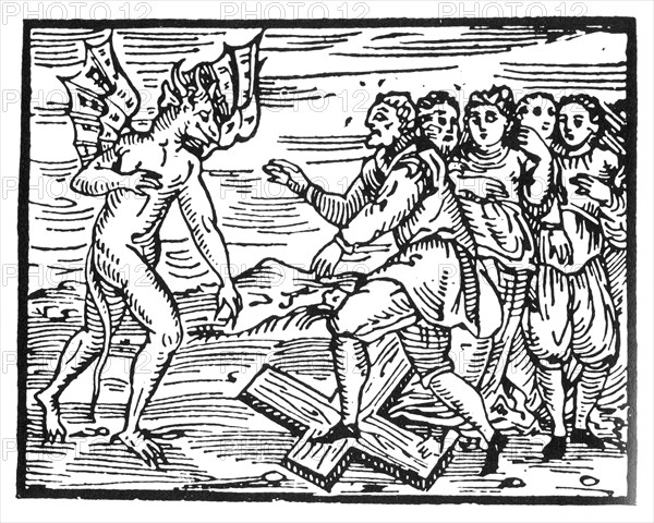 COMPENDIUM MALEFICARUM  Woodcut from the 1608 book on witches by Francesco Guazzo showing people renouncing Christ for the Devil