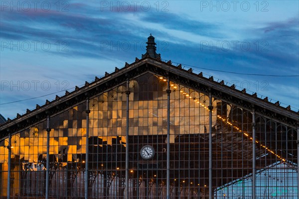A reflection of sunset on the lattice window of the Nyugati Railway Station in Budapest