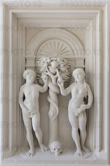 Adam and Eve. Plaster cast of the relief from the Renaissance altarpiece by German sculptor Johann Brabender (1546) from the Hildesheimer Domlettner on display in the Cathedral Museum (Dom Museum) in Hildesheim in Lower Saxony, Germany.