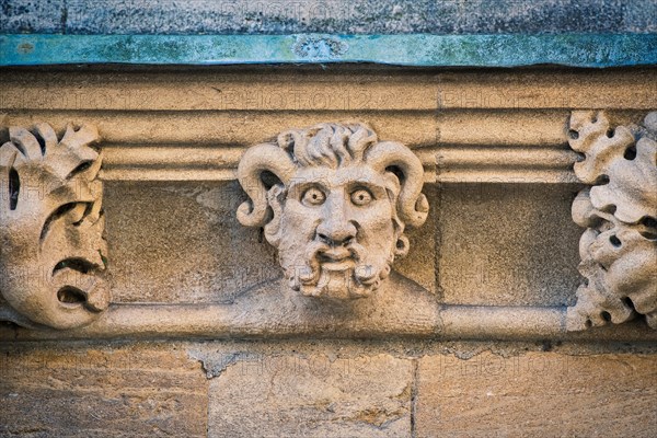 Carved stone horned gargoyle / grotesque on Merton college. Oxford, Oxfordshire, England