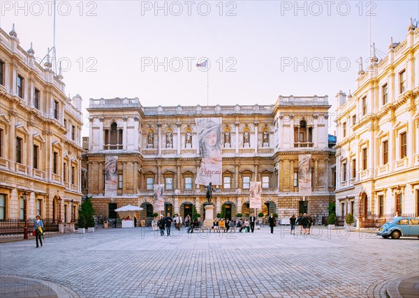 London, UK - April 30, 2011: People at Royal Academy of Arts at Burlington house on Piccadilly in London city in the UK. Cityscape with tourists at museum building in Old town, England.