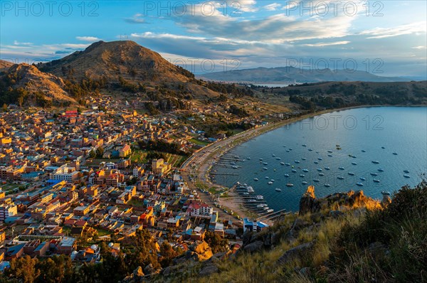 Aerial cityscape of Copacabana city at sunset by the Titicaca Lake, Bolivia.