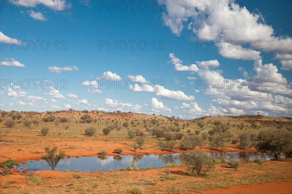 Desert landscape after recent rains, seen from The Ghan train south of Alice Springs, Northern Territory, Australia