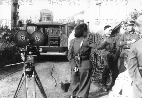 LENI RIEFENSTAHL (1902-2003) German film director and actress with army officers during the invasion of Poland in September 1939
