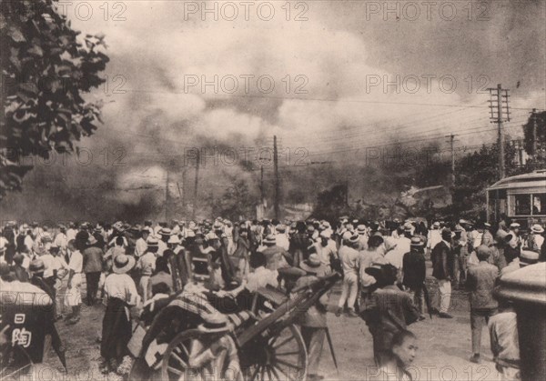 Japan Earthquake 1923: The tramway crossing outside Hibiya Park, enveloped & levelled to the ground by flames soon after the severe shock of Sept. 1