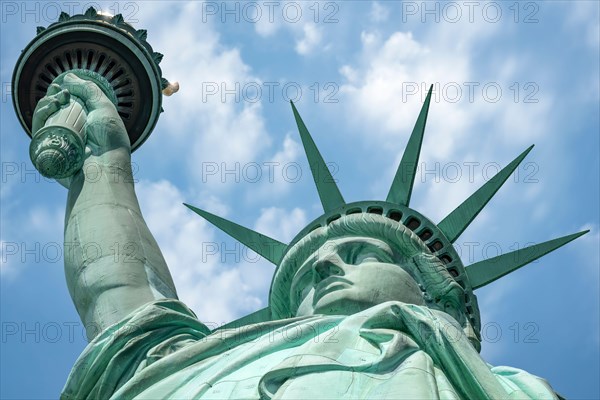 The Statue of Liberty standing on Liberty Island in the middle of New York Harbor, Manhattan, New York - USA.