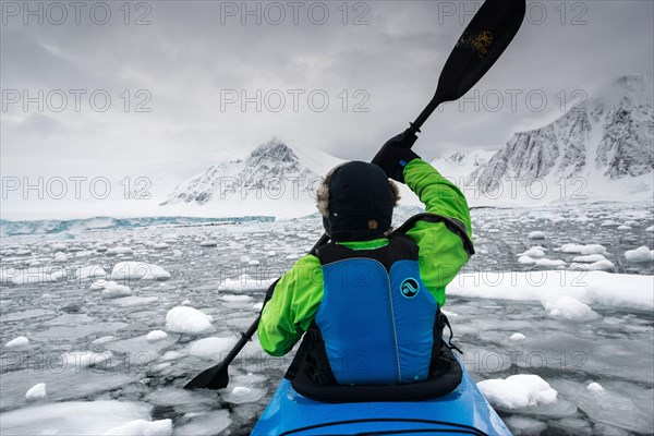 Scenery kayaking through brash ice close to Neny Island within Marguerite Bay, south of Antarctic Circle  (approx 68S),  Antarctica