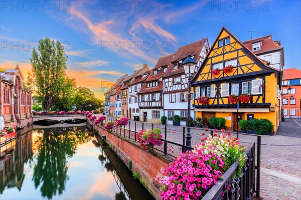 Colmar, Alsace, France. Petite Venice, water canal and traditional half timbered houses.