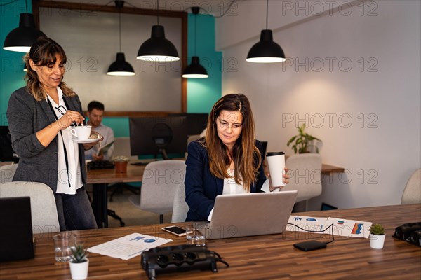 Business people working inside coworking creative space