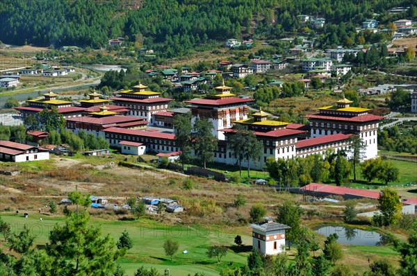 View of Thimphu Dzong over golf course, Bhutan
