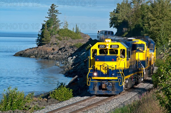 Alaska Railroad train riding along Turnagain Arm in Alaska