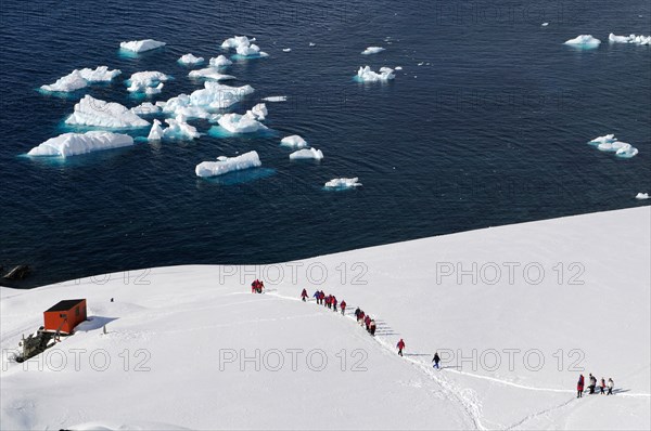 Tourists at Antarctic base Almirante Brown in Paradise Bay, Antarctic Peninsula, Antarctica