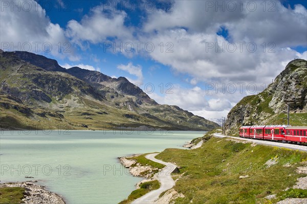 The Glacier Express train winds its way around the rocky mountain lakes of Switzerland