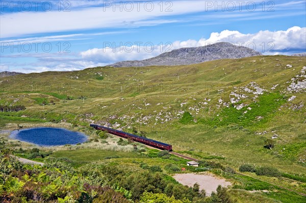 The afternoon Jacobite steam train heading towards Mallaig from Morar in the west highlands of Scotland