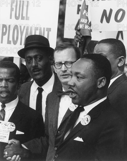 Dr. Martin Luther King, Jr. (right), President of the Southern Christian Leadership Conference with Mathew Ahmann (center), Executive Director of the National Catholic Conference for Interrracial Justice during the March on Washington for Jobs and Freedom August 28, 1963 in Washington, DC.