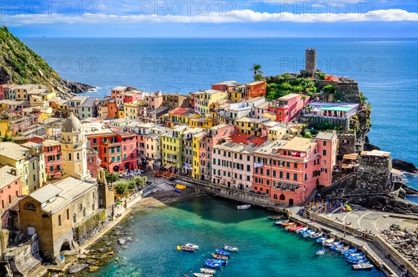 Scenic view of ocean and harbor in colorful village Vernazza, Cinque Terre, Italy