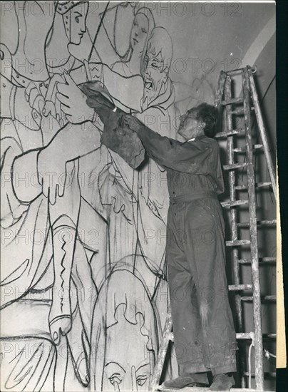 Oct. 10, 1956 - Cocteau decorates Chapel: Jean Cocteau, the famous French Poet and Playwright who is also a talented painter, has undertaken to decorate the chapel of the Church at Villefranche sur mer, on the French Riviera. He thus follows in the footsteps of Mathis who decorated the chapel at Vance some time ago. Photo shows Jean Cocteau at work in the chapel of Villefranche.