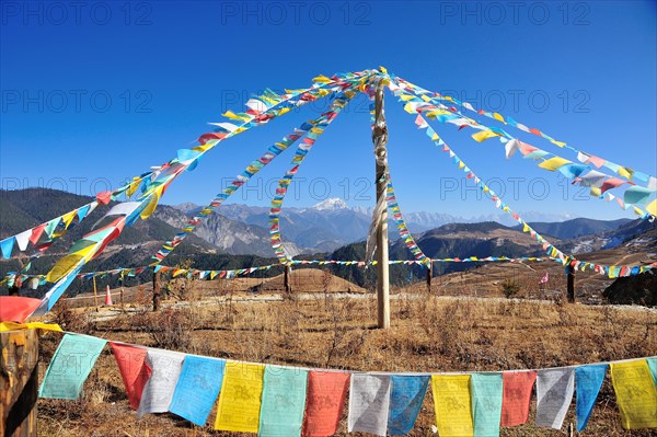 Prayer flag with mountain in far back