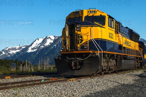 An Alaska Railroad train traveling between Seward and Anchorage by Turnagain Arm, Southcentral Alaska, United States of America