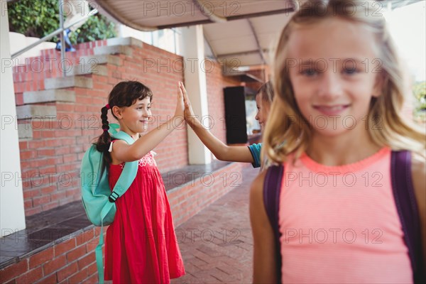 Three happy kids at school