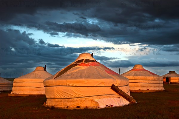 Gers or yurts of the Khatan Ugii Tourist Camp at sunset at Lake Ogii Nuur, Mongolia