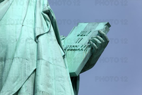 The USA, New York city, the Statue Liberty, detail, arm with notice board, declaration independence 4th July, 1776,