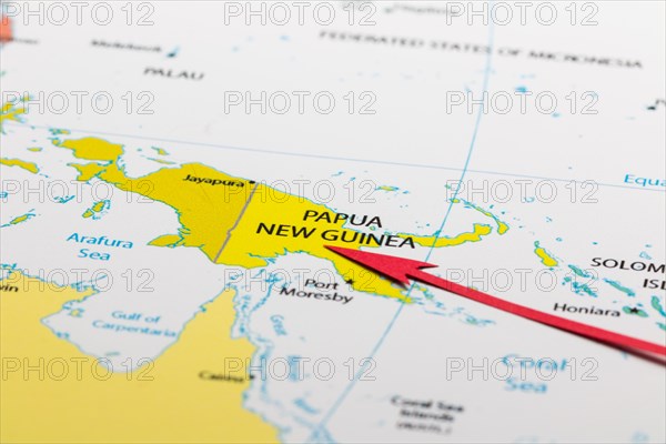 Red arrow pointing Papua New Guinea on the map of Austalia continent