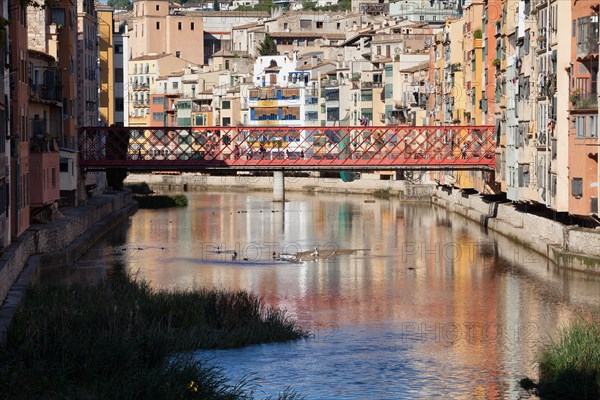 Historic houses and the Eiffel Bridge over the Onyar River in Girona, Catalonia, Spain