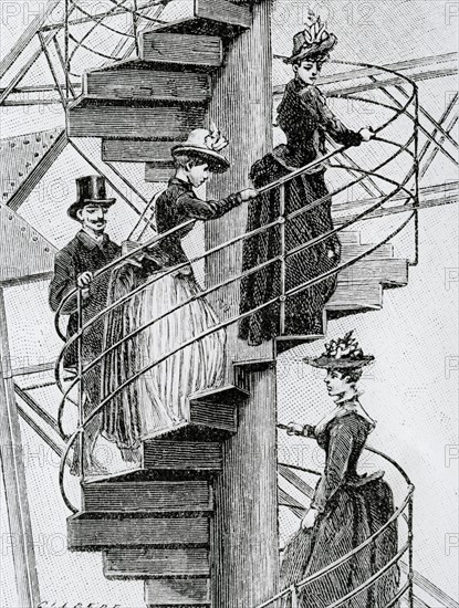 Eiffel Tower, people climbing the spiral staircase of the tower