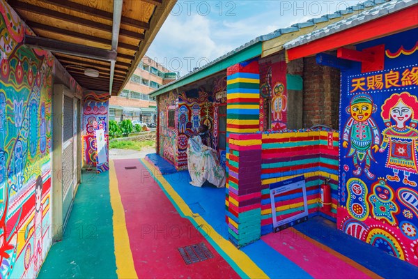 TAICHUNG, TAIWAN - JULY 19: Rainbow village is a popular travel destination where people can view colorful paintings and illustrations on the walls of