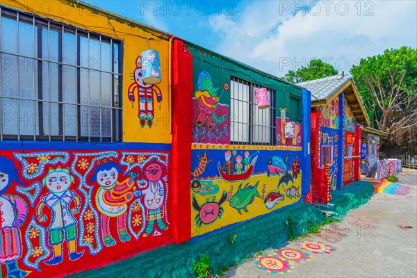 TAICHUNG, TAIWAN - JULY 19: Rainbow village is a popular travel destination where people can view colorful paintings and illustrations on the walls of