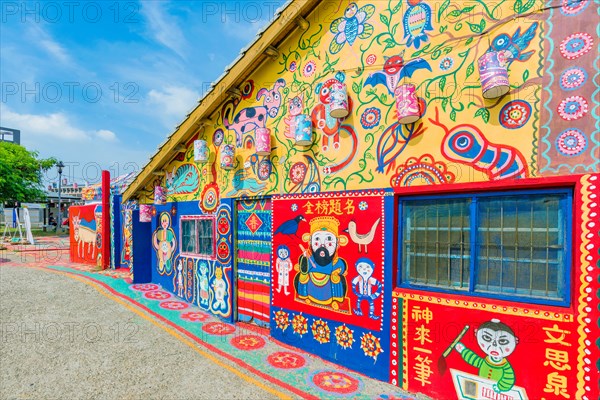 TAICHUNG, TAIWAN - JULY 19: Rainbow village is a popular travel destination where people can view colorful paintings and illustrations on the walls of