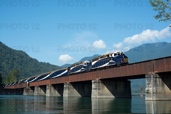 The Rocky Mountaineer crosses the Harrison River in Harrison Mills, British Columbia, Canada.