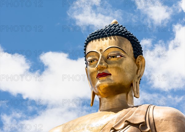 Close up of the Great Buddha Dordenma statue on a hilltop outside of Thimphu, Bhutan.