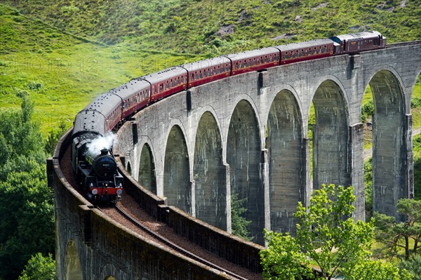 The Jacobite Express also known as the Hogwarts Express crosses the Glenfinnan Viaduct on route between Fort William and Mallaig.