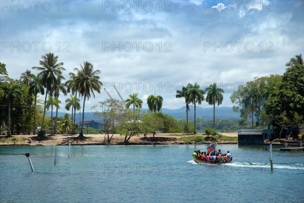 Small boat with passengers, Madang Harbour, Madang, PNG.