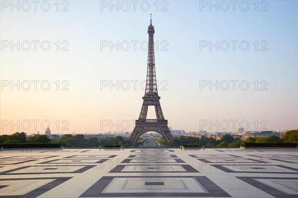 Eiffel tower, empty Trocadero, nobody in a clear summer morning in Paris, France