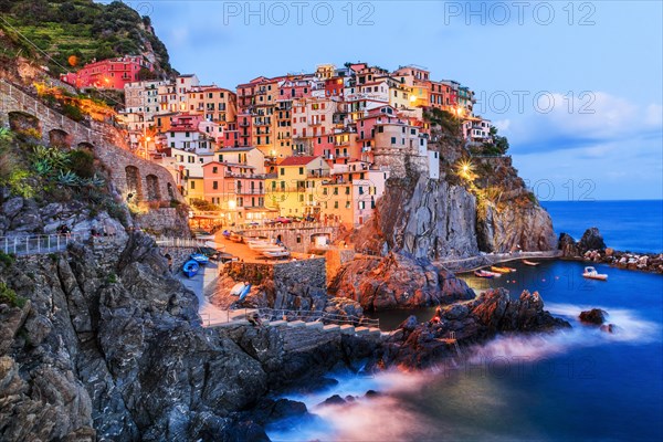 Manarola, Cinque Terre, Italy. Panoramic view of Manarola village at night.