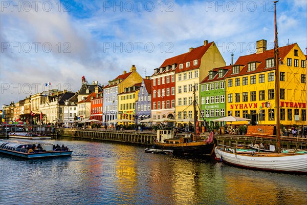 Nyhavn, a 17th century canal and harbour area with bars and restaurants and popular with tourists, in the capital city of Copenhagen, Denmark. 2019.