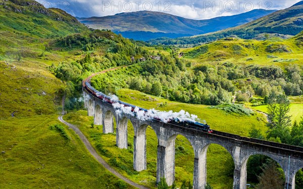 Pic shows The Jacobite Express (The train made famous as the Hogwarts Express in the Harry Potter films) crosses the Glenfinnan Viaduct in the Scottis