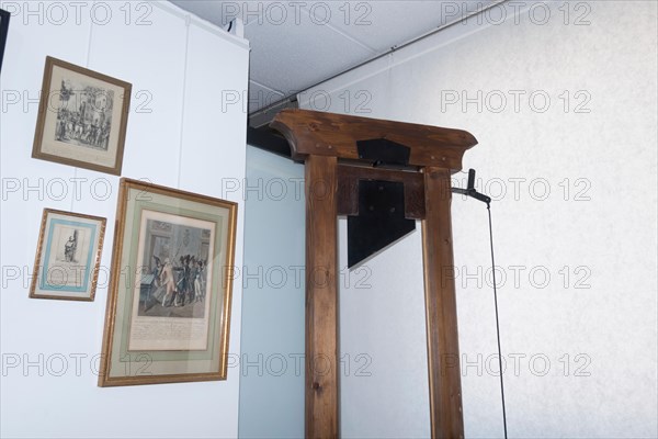 Paris, France - Sept 03, 2019: A guillotine displayed in the Exhibition in the  "Musee de la Prefecture de Paris", (Police Museum) in Paris, France.
