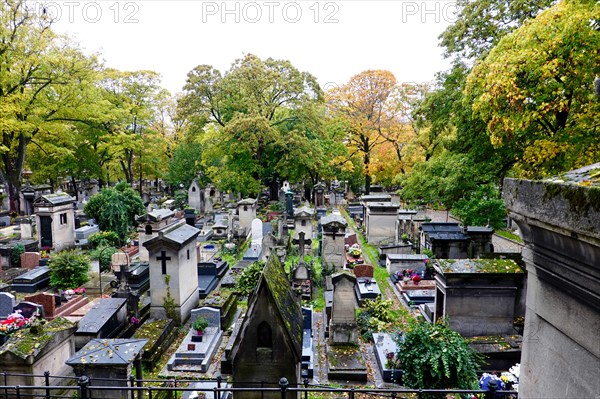 All Saints Day, in Montmartre Cemetery with autumnal, fallen leaves, Paris, France.