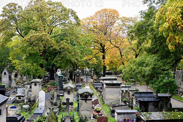 All Saints Day, in Montmartre Cemetery with autumnal, fallen leaves, Paris, France.