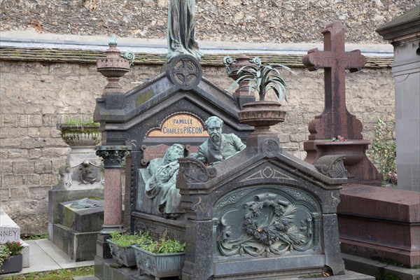 The family tomb of Charles Pigeon in Montparnasse Cemetery in Paris features a life sized bronze of Pigeon and his wife