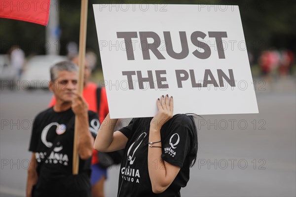 Bucharest, Romania - August 10, 2020: People display Qanon messages on cardboards during a political rally.