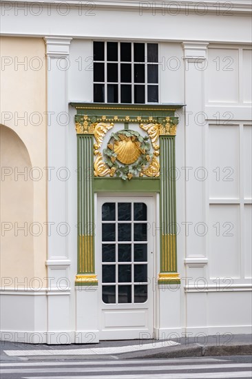 Paris, an ancient door, beautiful decorated facade in the Opera district