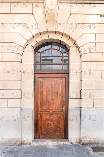 Paris, an old wooden door, typical building in the center